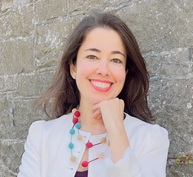 Maria Carolina smiling outdoors